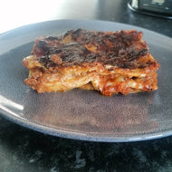 LASAGNE Oven backed layers of pasta with rich homemade bolognese ragù sauce, creamy besciamelle e parmigiano