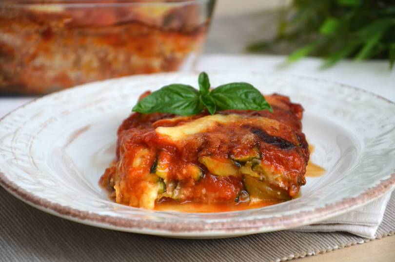 ZUCCHINE ALLA PARMIGGIANA Courgette layers with tomato, Sardinian cheese baked in the oven.